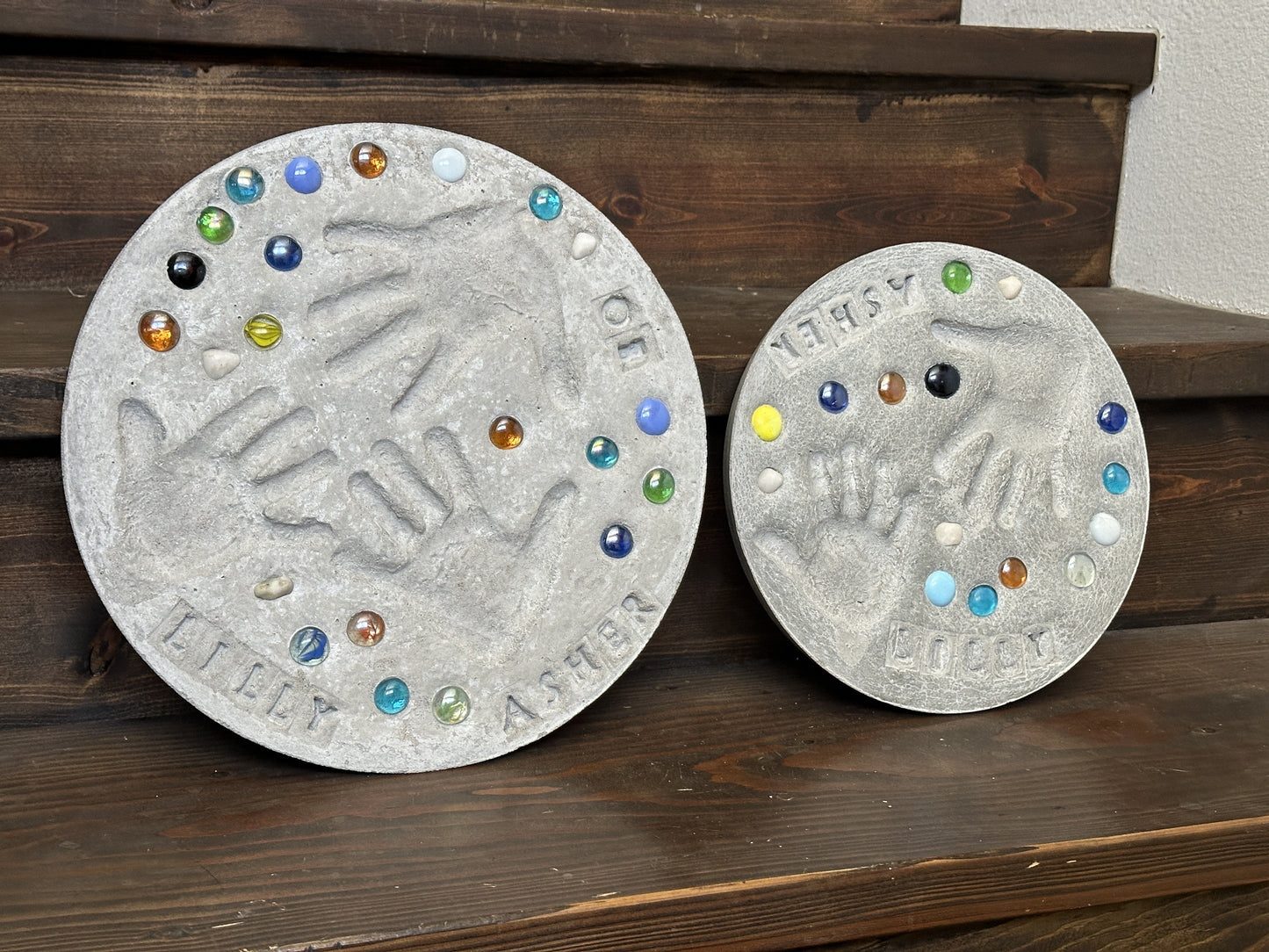 Family Stepping Stones. Mommy and Me Gift. These are garden stones displayed in our home for decor. In the image the stones are stood up vertically on a step, which is another great orientation to show these off.